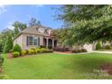 Brick house with landscaping and a 2-car garage at 15814 Vale Ridge Dr, Charlotte, NC 28278
