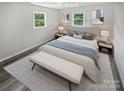 Spacious bedroom with neutral decor and wood-look floors at 8819 Richardson King Rd, Waxhaw, NC 28173