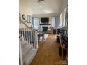 Living room with hardwood floors, fireplace and staircase at 5417 Spindle Ridge Ln, Gastonia, NC 28056