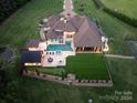 Luxury home with pool, outdoor kitchen, and sports court at 514 Billy Howey Rd, Waxhaw, NC 28173
