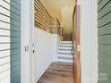 Bright entryway with hardwood floors and modern staircase at 8009 Elevate Ct, Charlotte, NC 28205