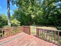 Wooden back deck overlooks a private wooded backyard at 2232 Stallings Rd, Matthews, NC 28104
