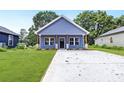 Charming craftsman style home with gray siding and a front porch at 1332 Caldwell St, Statesville, NC 28677