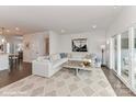 Spacious living room with L-shaped sofa and access to patio at 136 Wesser St # 53, Davidson, NC 28036