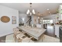 Bright dining room with large table and chandelier at 136 Wesser St # 53, Davidson, NC 28036