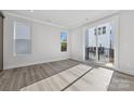 Well-lit bedroom with sliding glass doors leading to a private balcony at 1432 Hamilton St # 14, Charlotte, NC 28206