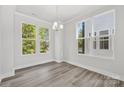 Spacious dining area with hardwood floors and large windows at 1432 Hamilton St # 14, Charlotte, NC 28206