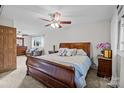 Main bedroom with hardwood floors and wooden sleigh bed at 2721 Secrest Short Cut Rd, Monroe, NC 28110