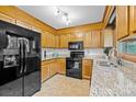 Kitchen features granite countertops and black appliances at 2721 Secrest Short Cut Rd, Monroe, NC 28110