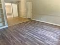 Living room with laminate flooring and built-in shelves at 2753 Harmony Hwy, Harmony, NC 28634