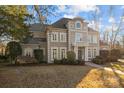 Impressive two-story home with manicured lawn and mature trees at 3727 Mooreland Farms Rd, Charlotte, NC 28226