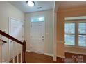 Bright entryway with staircase, coat closet, and view to living area at 135 S Arcadian Way, Mooresville, NC 28117