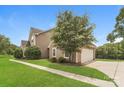 Two-story house with attached garage and landscaped yard at 15129 Dartford Ln, Mint Hill, NC 28227