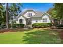 Two story home with double doors and manicured lawn at 19577 Meta Rd, Cornelius, NC 28031