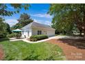 Detached garage with a patio area and landscaping at 19577 Meta Rd, Cornelius, NC 28031