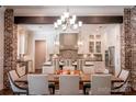 Modern kitchen with white cabinets, brick accents, and an island at 182 Shagbark Ct, Mount Gilead, NC 27306