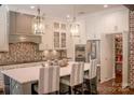 Modern kitchen with white and gray cabinets and large pantry at 182 Shagbark Ct, Mount Gilead, NC 27306