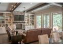 Cozy living room with a brick fireplace and built-in shelving at 182 Shagbark Ct, Mount Gilead, NC 27306