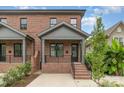 Brick front of two-story home with gray accents and porch at 2112 Kirkwood Ave, Charlotte, NC 28203