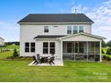 Spacious backyard with patio, fire pit and screened porch at 211 Coronado Ave # 57, Matthews, NC 28104