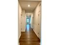 Bright hallway with light brown wood flooring at 14322 Hugh Dixon Way, Huntersville, NC 28078