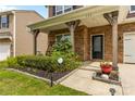 Inviting front porch with stonework and landscaping at 133 Lassen Ln, Mooresville, NC 28117