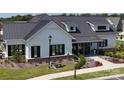 Exterior of a charming community clubhouse with a metal roof at 212 Portrait Way, Indian Trail, NC 28079