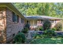 Brick house exterior showcasing the front entrance and landscaping at 1890 Rhyneland Rd, Lincolnton, NC 28092