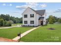Two-story white house with black windows and walkway at 103 Dublin Ct, Statesville, NC 28677