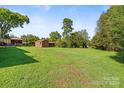 Expansive grassy backyard offering ample space and privacy at 2110 E Greenbriar Rd, Statesville, NC 28625