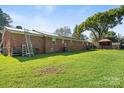 Large backyard with spacious lawn, detached shed, and gazebo at 2110 E Greenbriar Rd, Statesville, NC 28625