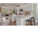 Modern kitchen featuring white cabinets, quartz countertops, and stainless steel appliances at 3022 Loso Ter # 52, Charlotte, NC 28217