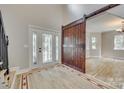 Entryway with stained glass door and barn door at 164 Quiet Cove Rd, Mooresville, NC 28117