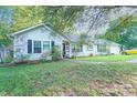 Charming ranch home with lush landscaping and a spacious yard at 8018 Maxwelton Dr, Huntersville, NC 28078