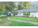 Simple yet elegant ranch home with a well-manicured lawn at 8018 Maxwelton Dr, Huntersville, NC 28078
