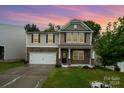 Two-story home with stone and siding accents; inviting front porch at 116 Kona Rd, Mooresville, NC 28117