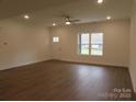 Bright living room with hardwood floors and large windows at 3910 Jenkins Rd, Clover, SC 29710