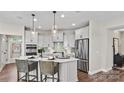 Modern kitchen with island and stainless steel appliances at 7567 Baybrooke Ln # 35, Harrisburg, NC 28075