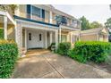 Charming two-story home with landscaped yard and porch at 7026 Quail Hill Rd, Charlotte, NC 28210