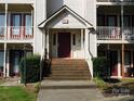 Building entrance with stairs and landscaping at 6117 Meadow Rose Ln, Charlotte, NC 28215