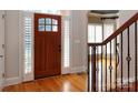 Hardwood floors, wood door, and elegant staircase at 4709 Trey View Ct, Mint Hill, NC 28227