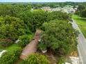 High-angle view of house and large lot, nestled in woods at 4539 S New Hope Rd, Gastonia, NC 28056