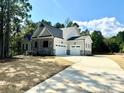 Two-car garage and a long driveway at 310 Scalybark Trl, Concord, NC 28027