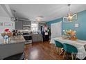 Kitchen with granite countertops and teal dining chairs at 629 Center St, Rock Hill, SC 29730