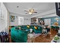 Open living room with green sectional sofa and kitchen view at 629 Center St, Rock Hill, SC 29730