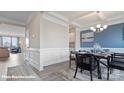 Bright dining room with a blue accent wall and wood dining table at 121 Saidin Ln, Troutman, NC 28166