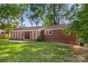 Brick ranch house with double front doors, set back from the street at 1573 Timberlake Dr, Shelby, NC 28150