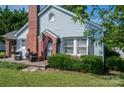 Charming light blue house with brick accents and porch at 1537 N Piedmont Ave, Kings Mountain, NC 28086