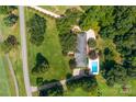 Aerial view of home with pool and large backyard at 3029 River Rd, Shelby, NC 28152