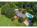 Aerial view of home with pool and large backyard at 3029 River Rd, Shelby, NC 28152